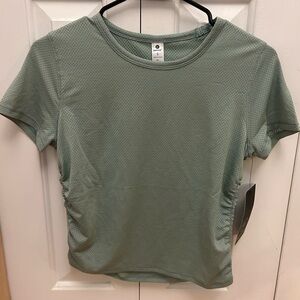 New with tags, greenish gray T-shirt, super breathable and light!